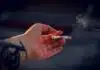 person holding white cigarette stick